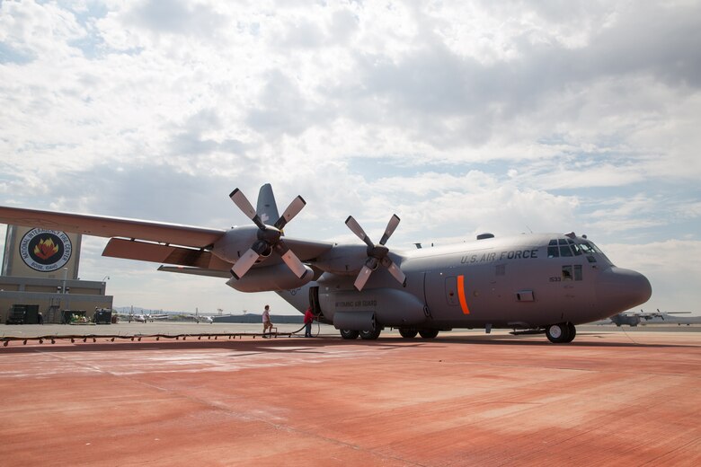 A Modular Airborne Fire Fighting System-equpped C-130 from the 153rd Airlift Wing prepares to take off in Boise, Idaho on July 28, 2013. Wyoming and North Carolina Air National Guard units are currently based at Boise in support of MAFFS missions. (U.S. Air National Guard photo by Tech. Sgt. Jeffrey Allred)