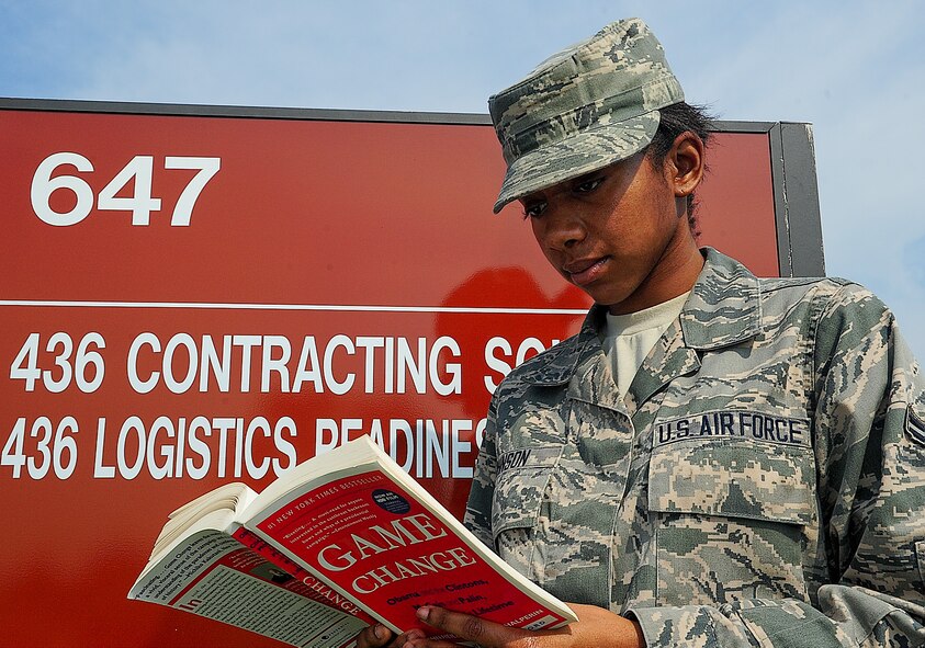 Airman 1st Class Tatjuna Talisa Johnson, 436th Contracting Squadron contracting specialist, reads a book by one of her favorite politicians July 31, 2013, at Dover Air Force Base, Del. Johnson is being recognized as Team Dover’s Airman of the Month (U.S. Air Force photo/Airman 1st Class Ashlin Federick)