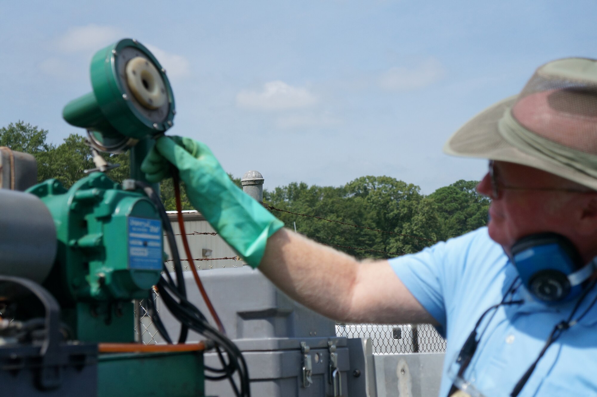 John Rourke, pest controller, gets the fogger ready for spraying. (U.S. Air Force photos by Jenny Gordon)