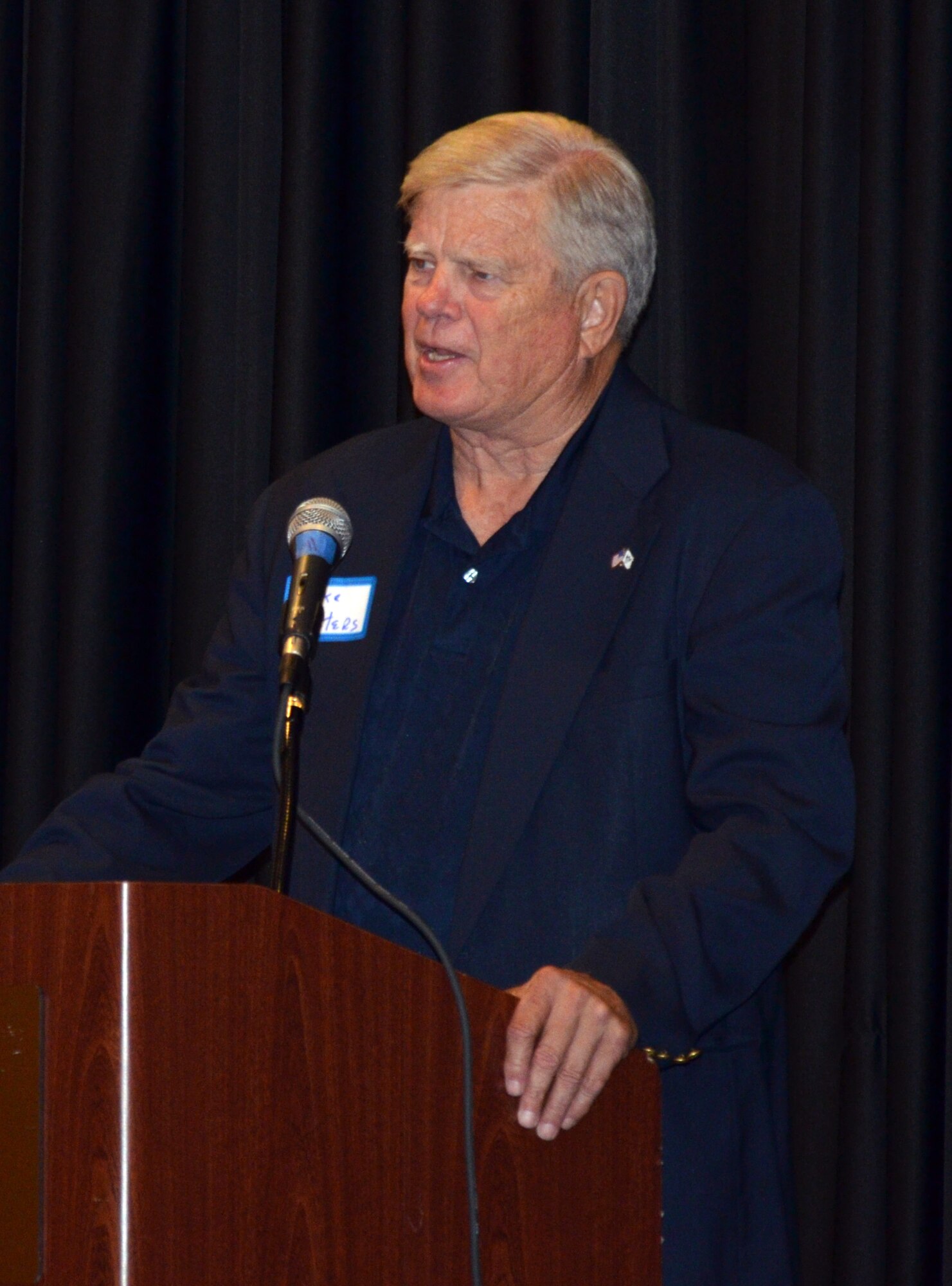 Retired Air Force Brig. Gen. Michael Peters, speaks to attendees at the 304th Rescue Squadron reunion banquet in Portland, Ore., July 27, 2013. Retired squadron members took turns sharing stories during the banquet. The 304th Rescue Squadron, Portland International Airport, Ore., is a geographically separated unit of the 920th Rescue Wing, Patrick Air Force Base, Fla. (U.S. Air Force photo/Tech. Sgt. Anna-Marie Wyant)