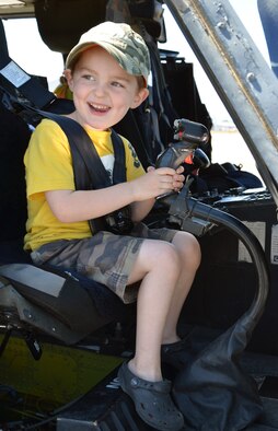 A young visitor at the 304th Rescue Squadron reunion picnic checks out a static display of an HH-60G Pave Hawk helicopter at Portland International Airport, Ore., July 28, 2013. The 304th Rescue Squadron is a geographically separated unit of the 920th Rescue Wing, Patrick Air Force Base, Fla. (U.S. Air Force photo/Tech. Sgt. Anna-Marie Wyant)