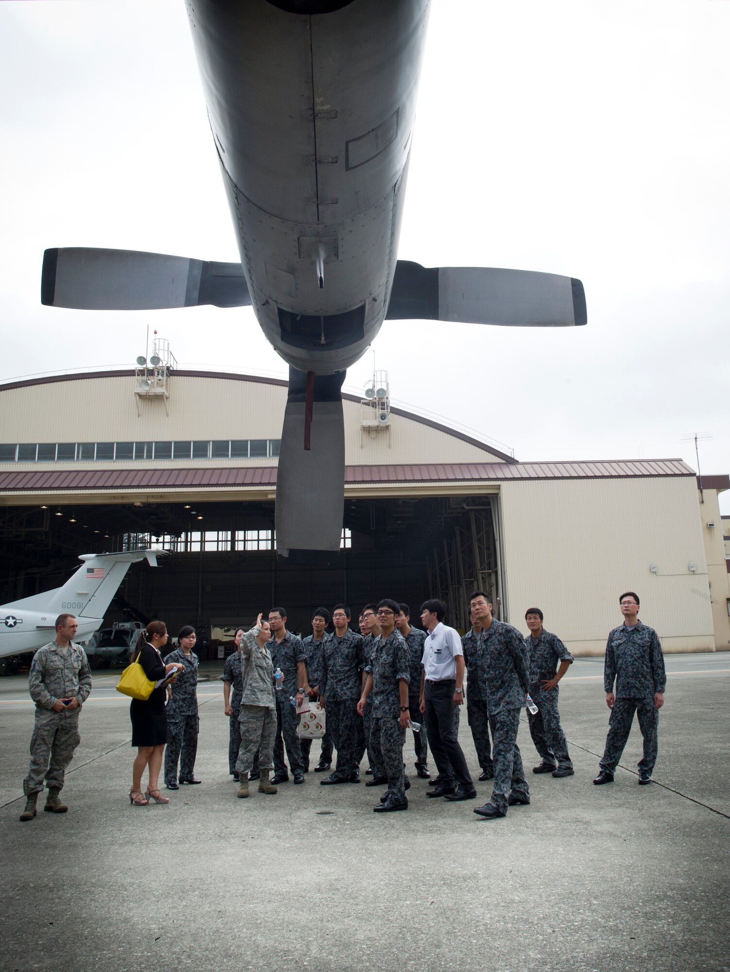 YOKOTA AIR BASE, Japan -- Japan Air Self-Defense Force maintenance officers receive a tour of a C-130 Hercules at Yokota Air Base, Japan, July 26, 2013, during an officer exchange program. During the visit, the officers toured several shops to learn about their procedures and equipment. (U.S. Air force photo by Staff Sgt. Stacy Moless)