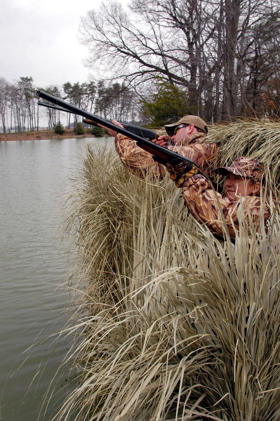 Hunting from shore, duck hunters take appropriate water safety measures.