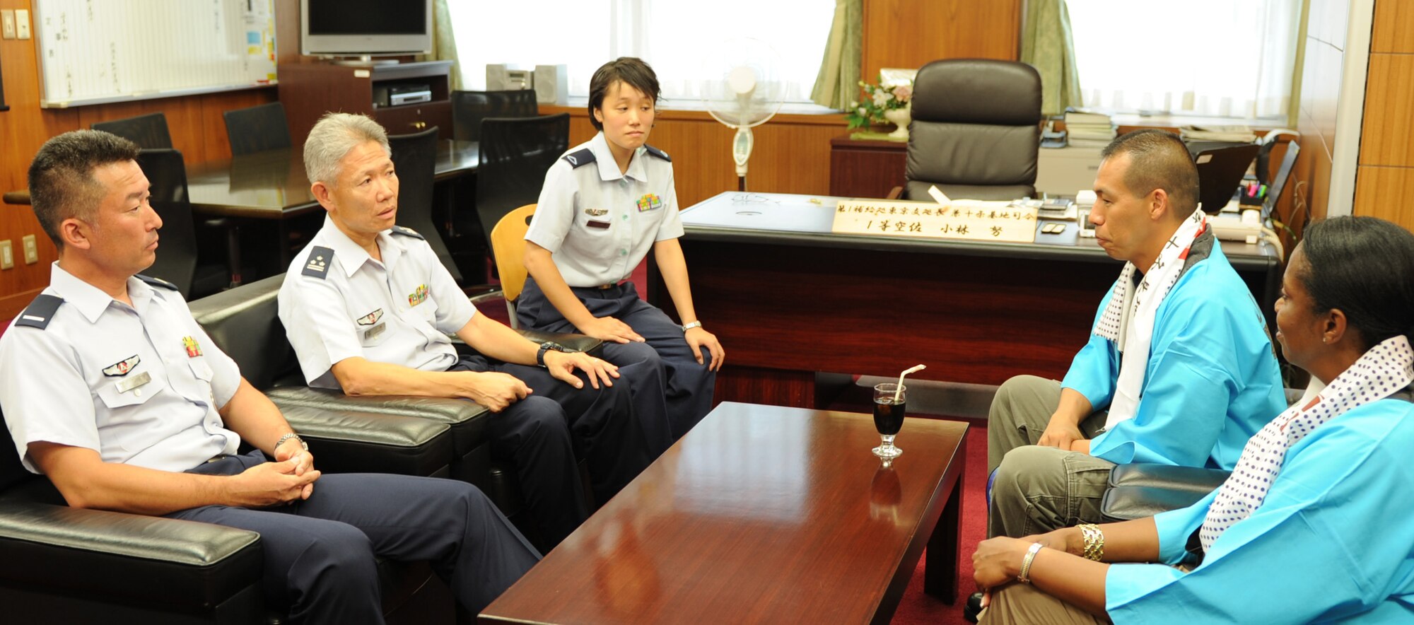 JUJO AIR STATION, Japan -- Japan Air Self-Defense Force leadership at Jujo Air Station, Japan, meet with enlisted leadership from the 374th Airlift Wing July 26, 2013, in the JASDF Air Materiel Command headquarters at Jujo. During the visit, the leaders talked about future events between the U.S. and JASDF. (U.S. Air Force photo by Senior Airman Desiree Economides)
