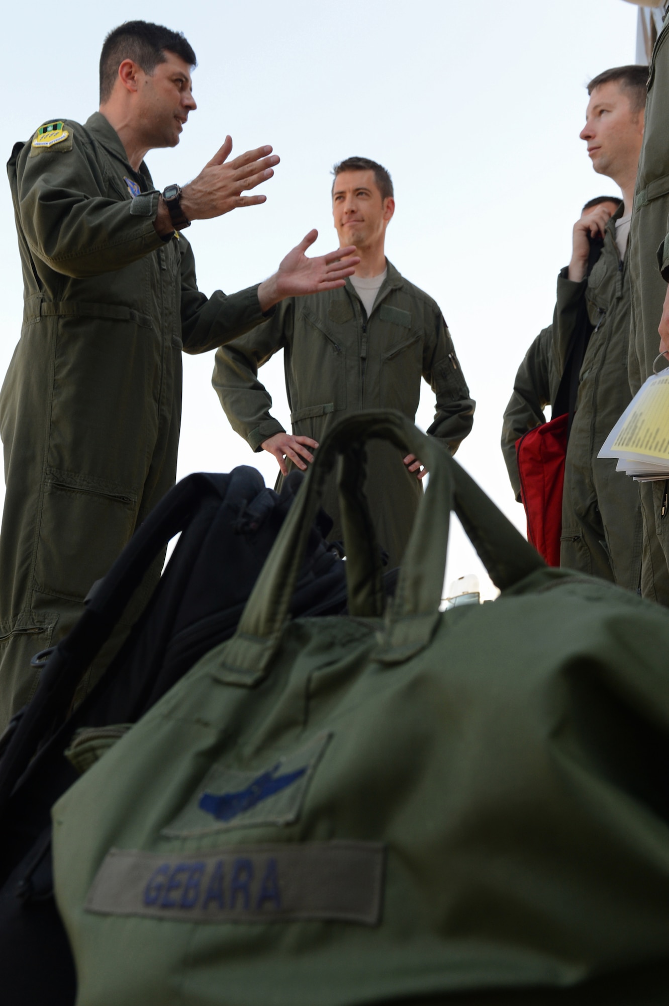 Col. Andrew Gebara, 2nd Bomb Wing commander, talks with aircrew members before a flight on Barksdale Air Force Base, La., July 29, 2013.  Aircrew from the 96th Bomb Squadron helped Gebara commemorate the 20th anniversary of his first flight in the B-52. A few of the crew members where in grade school when Gebara took his first flight in 1993. (U.S. Air Force photo/Senior Airman Micaiah Anthony)
