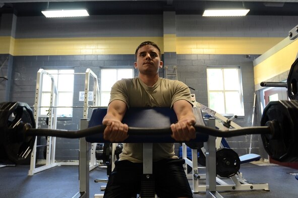 U.S. Air Force Senior Airman Adam Emberson, an avionics technician with the 169th Aircraft Maintenance Squadron, South Carolina Air National Guard at McEntire Joint National Guard Base, S.C., maintains his physical fitness during a workout in the base gym May 28, 2013.  (U.S. Air National Guard photo by Tech. Sgt. Caycee Watson/Released)