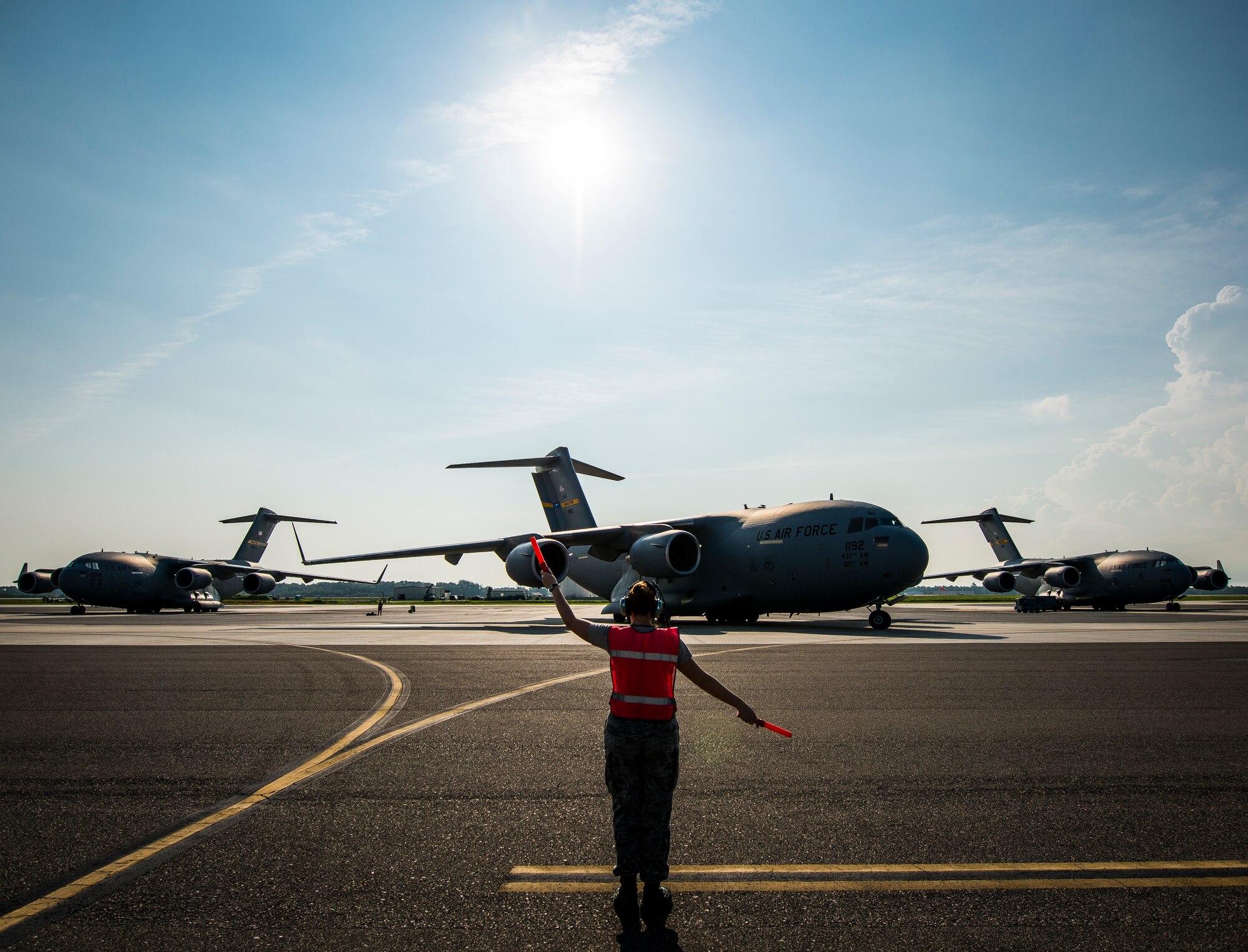 Senior Airman Brandi Barentine, 437th Aircraft Maintenance Squadron crew chief, marshals a C-17 Globemaster III July, 30, 2013, at Joint Base Charleston – Air Base, S.C. (U.S. Air Force photo/ Senior Airman Dennis Sloan)