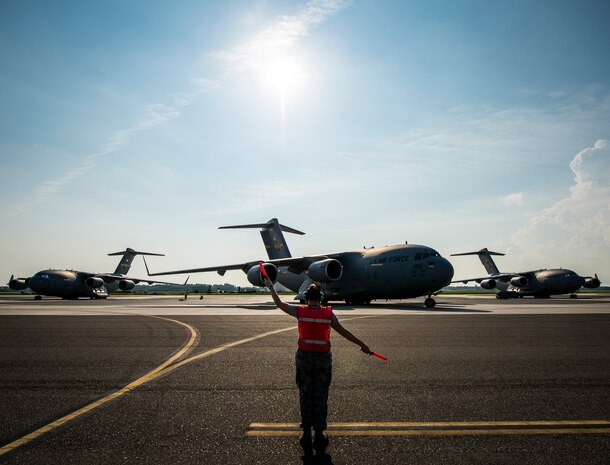 Senior Airman Brandi Barentine, 437th Aircraft Maintenance Squadron crew chief, marshals a C-17 Globemaster III July, 30, 2013, at Joint Base Charleston – Air Base, S.C. (U.S. Air Force photo/ Senior Airman Dennis Sloan)