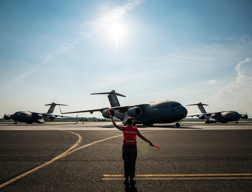 Senior Airman Brandi Barentine, 437th Aircraft Maintenance Squadron crew chief, marshals a C-17 Globemaster III July, 30, 2013, at Joint Base Charleston – Air Base, S.C. (U.S. Air Force photo/ Senior Airman Dennis Sloan)