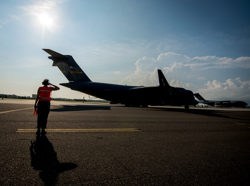 Senior Airman Brandi Barentine, 437th Aircraft Maintenance Squadron crew chief, salutes the pilots of a C-17 Globemaster III July, 30, 2013, at Joint Base Charleston – Air Base, S.C. (U.S. Air Force photo/ Senior Airman Dennis Sloan)