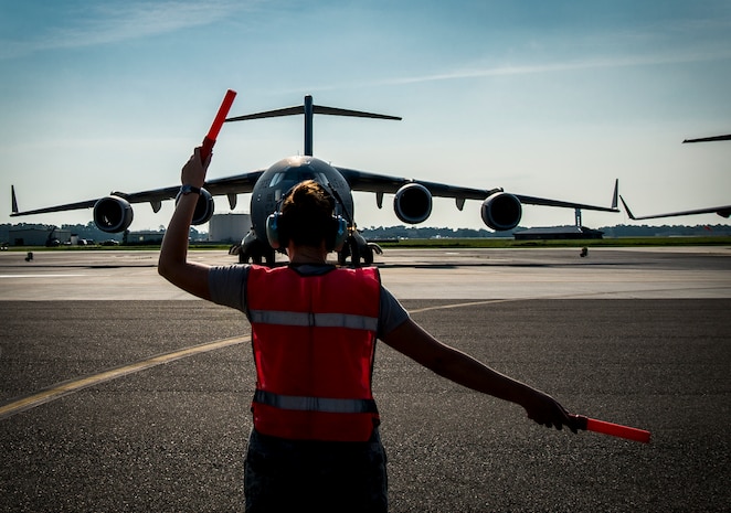 Senior Airman Brandi Barentine, 437th Aircraft Maintenance Squadron crew chief, marshals a C-17 Globemaster III July, 30, 2013, at Joint Base Charleston – Air Base, S.C. (U.S. Air Force photo/ Senior Airman Dennis Sloan)