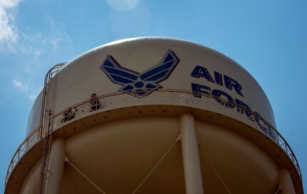 (Left) Staff Sgt. David Ertwine, and (right) Senior Airman Michael Ang, 628th Civil Engineer Squadron water fuels system maintenance craftsmen, rest on a walkway near the top of a water tower before making the final climb to the top to perform a chlorine test July 29, 2013, at Joint Base Charleston – Air Base, S.C. The water tower is used in emergencies such as destruction from hurricanes or heavy storms. The water’s chlorine level was safe for human consumption. (U.S. Air Force photo/ Senior Airman Dennis Sloan)