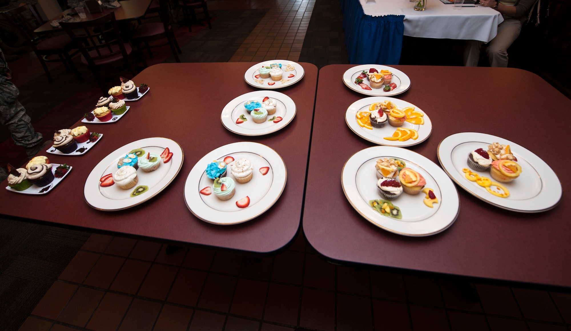 Completed cupcakes sit on a table ready for the judges during Cupcake Wars 3 at Moody Air Force Base, Ga., July 23, 2013. Teams had to bake three cupcakes, and at least one cupcake had to contain the secret ingredient of tropical fruit. (U.S. Air Force photo by Senior Airman Jarrod Grammel/Released)
