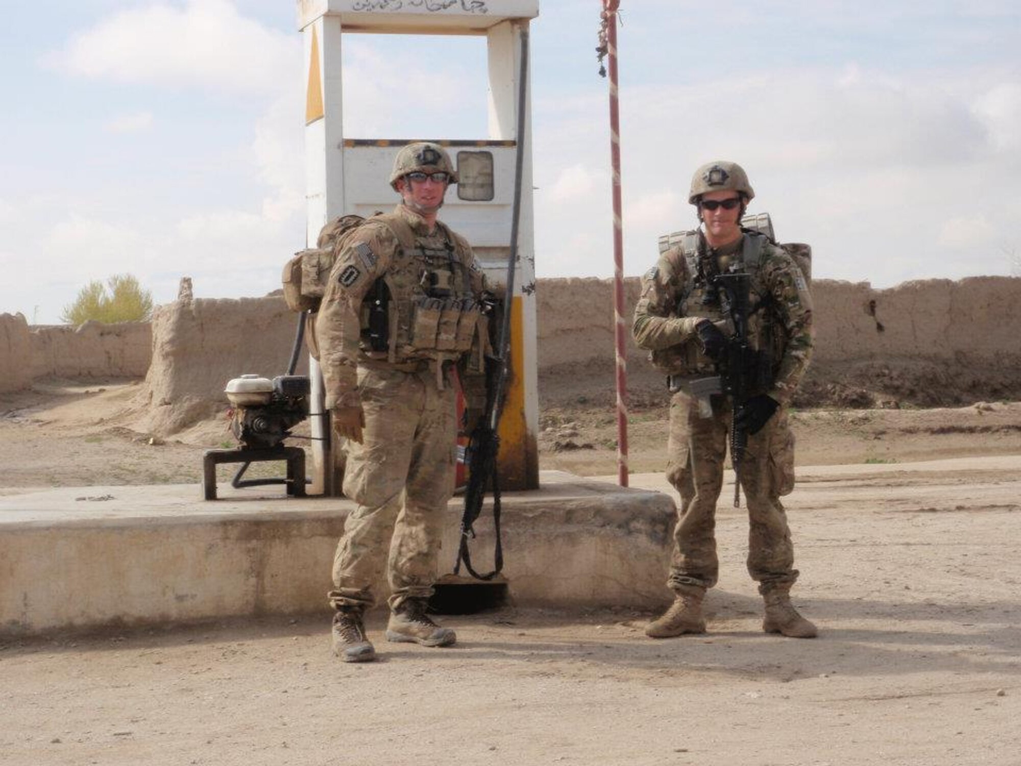 U.S. Air Force Tech. Sgt. Tracy Passerotti, 4th Civil Engineer Squadron explosive ordnance disposal (EOD) NCO in-charge of logistics, and Senior Airman Justin Beasley, 4th CES EOD craftsman, patrol a village while deployed to Afghanistan in support of OPERATION ENDURING FREEDOM, 2012. During the deployment, Passerotti lead a team of EOD technicians that supported three U.S. Army forward operating bases, ultimately ridding villages of approximately 2,200 pounds of explosives and 51 improvised explosive devices.  Passerotti’s outstanding contribution to the EOD career field as a civil engineering NCO earned him the 2012 Major General Eugene A. Lupia award. (Courtesy photo)