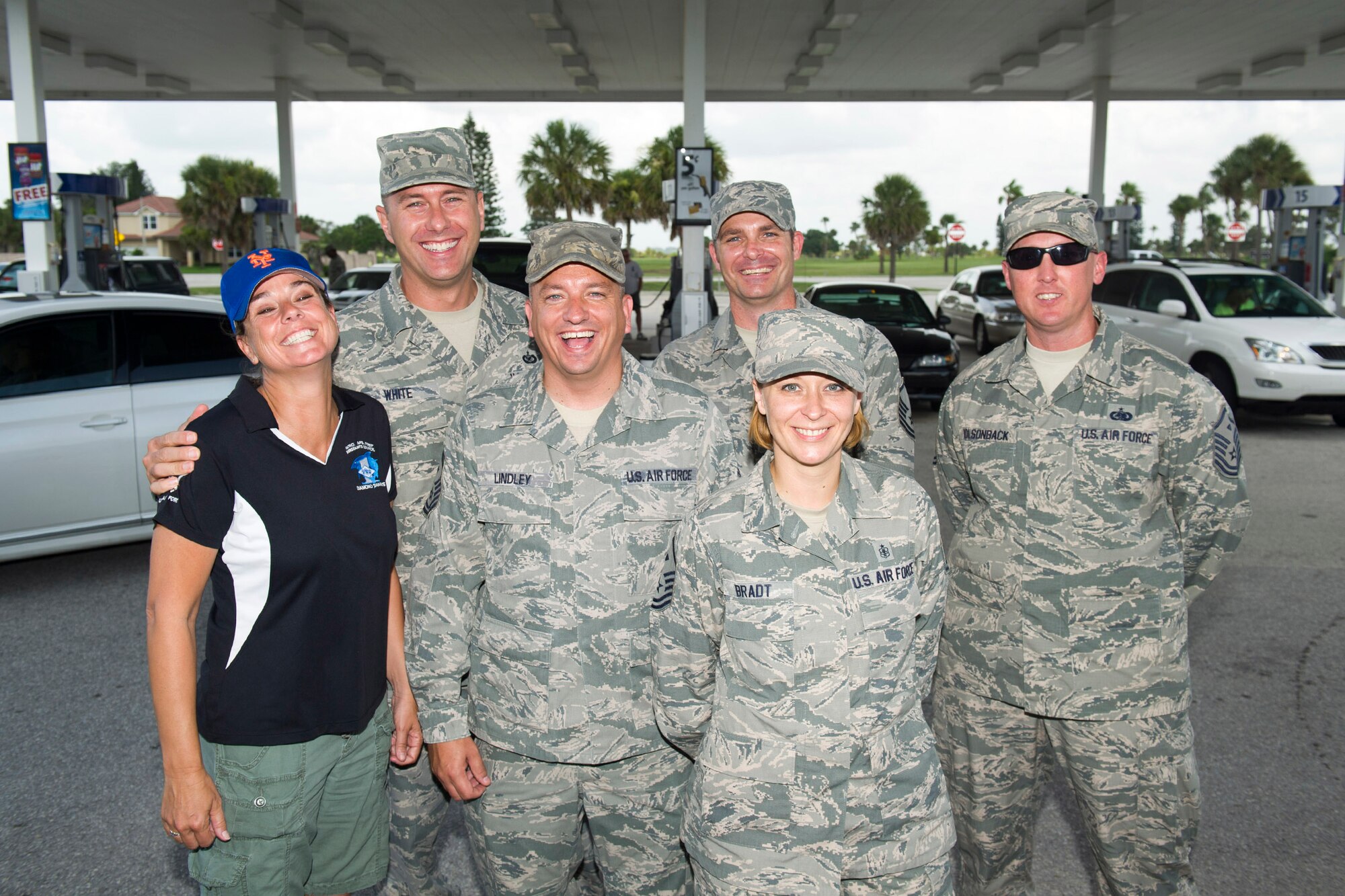First sergeants from around the 45th Space Wing and our mission partners, surprised junior enlisted Airmen and their family members by providing $25 gas cards at the Express, formally known as the Shoppette, at Patrick Air Force Base, Fla., July 24, 2013. (Left to right) Master Sgt. Kim Melton, 45th Operations Group, Master Sgt. David White, 45th Medical Group, Senior Master Sgt. Mike Lindley, Air Force Technical Applications Center, Master Sgt. Thomas Phillips, 45th Civil Engineer Squadron, Master Sgt. Agnes Bradt, Wing Staff, and Master Sgt. Luther Holsonback, 45th Security Forces Squadron. (U.S. Air Force photo/Cory Long) (Released)
