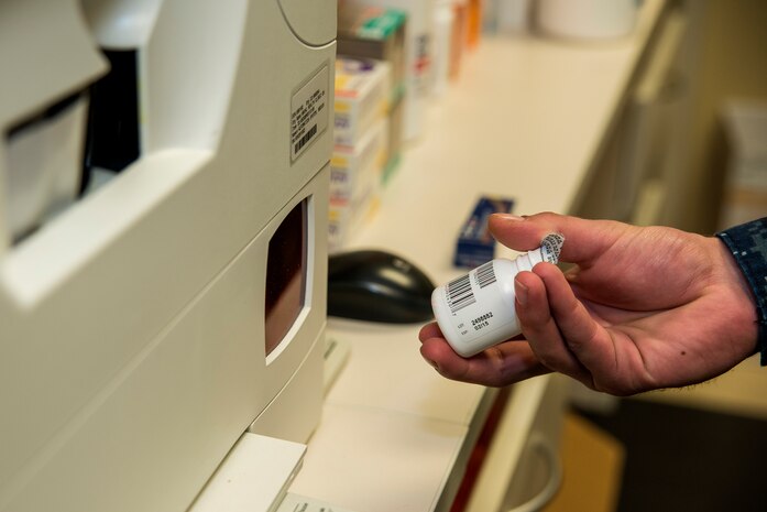 Seaman Colton Breininger, Naval Health Clinic Charleston hospital corpsman, scans a pill bottle into the system at the NHCC pharmacy, July 29, 2013, at Joint Base Charleston - Weapons Station, Goose Creek, S.C. NHCC provides quality healthcare services for approximately 12,000 beneficiaries throughout the LowCountry, including a sick call clinic for Sailors assigned to the Weapons Station. (U.S. Air Force photo/ Senior Airman George Goslin)