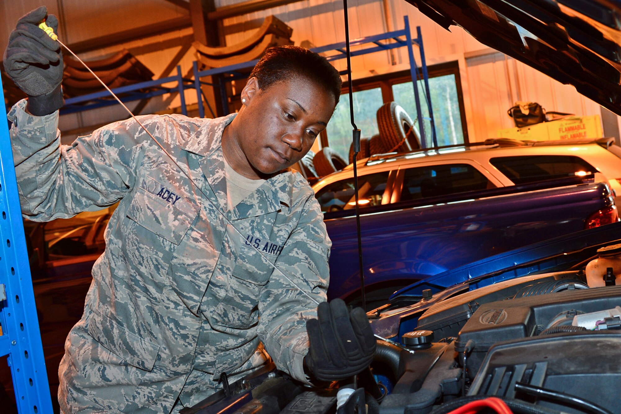 Airman 1st Class Dejanae Acey, 48th Logistics Readiness Squadron vehicle operator, checks the oil on a government vehicle at Royal Air Force Lakenheath, England, July 31, 2013. Airmen from the 48th Maintenance Group and 48th Logistics Readiness Squadron were preparing for an upcoming Logistics Compliance Assessment Program inspection. The five-day inspection focuses on checklist compliance, quality verification inspections and personnel evaluations within different units. (U.S. Air Force photo by Airman 1st Class Dana J. Butler/Released)