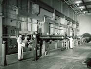 AEROBALLISTIC LAUNCH PREPARATION-Final step is the insertion of powder charge into breech launcher. In sequence, powder compresses hydrogen, hydrogen drives piston, piston compresses hydrogen in pump tube which accelerates model to desired velocity. The free-flight models will be fired through the 1,000-foot range at velocities up to and exceeding Mach 20. The test unit, 1,000-ft Hypervelocity Range-G, is part of the von Karman Gas Dynamics Facility at AEDC. (1963 AEDC Photo)