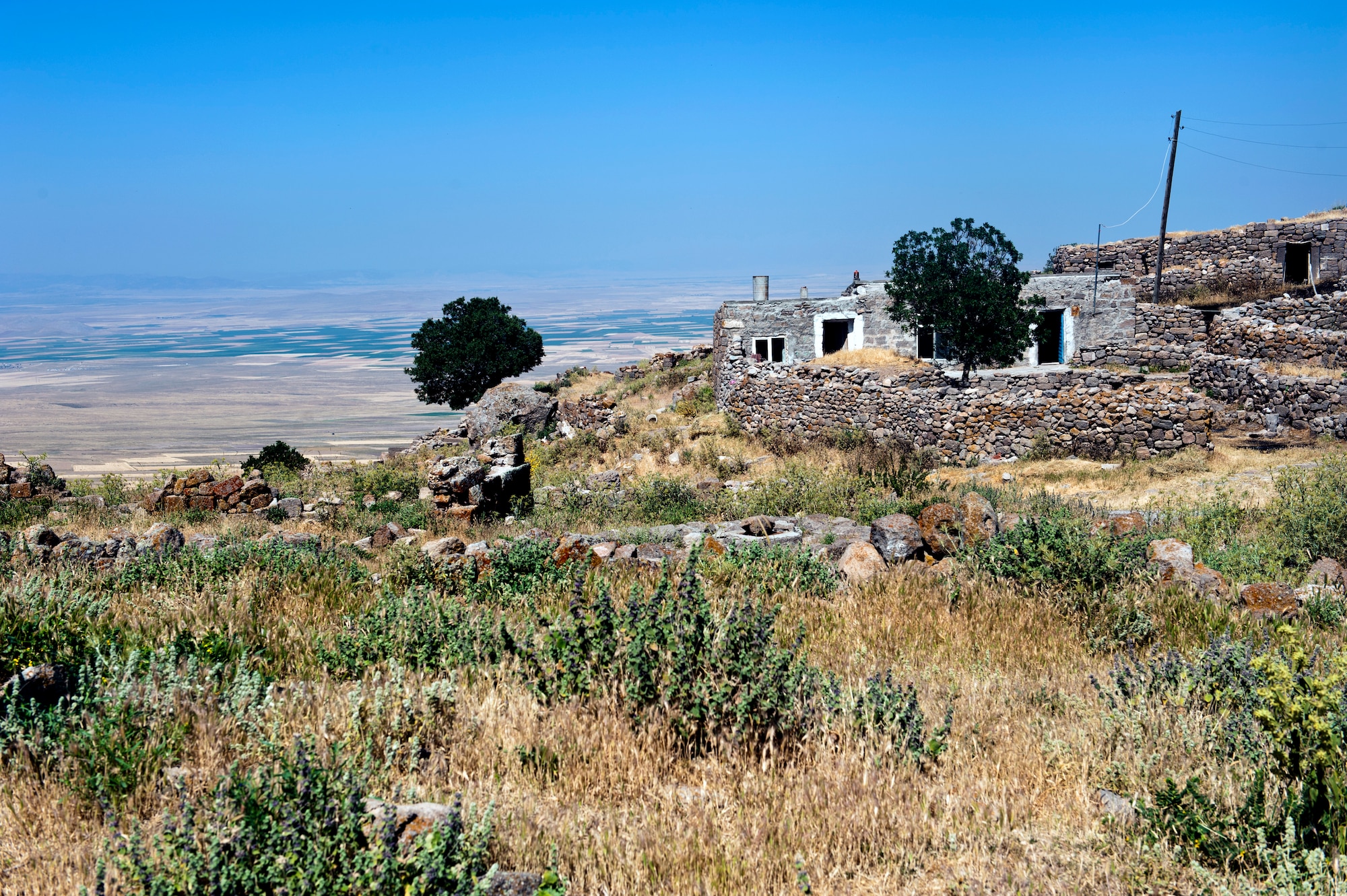 A house lies on the side of a mountain, overlooking a valley June 31, 2013, Karaman province, Turkey. Stones from an ancient city are still used to build homes in the Region of 1001 Churches.  The Region of 1001 Churches was often visited by the Apostle Paul during his missionary journeys. (U.S. Air Force photo by Senior Airman Daniel Phelps/Released)