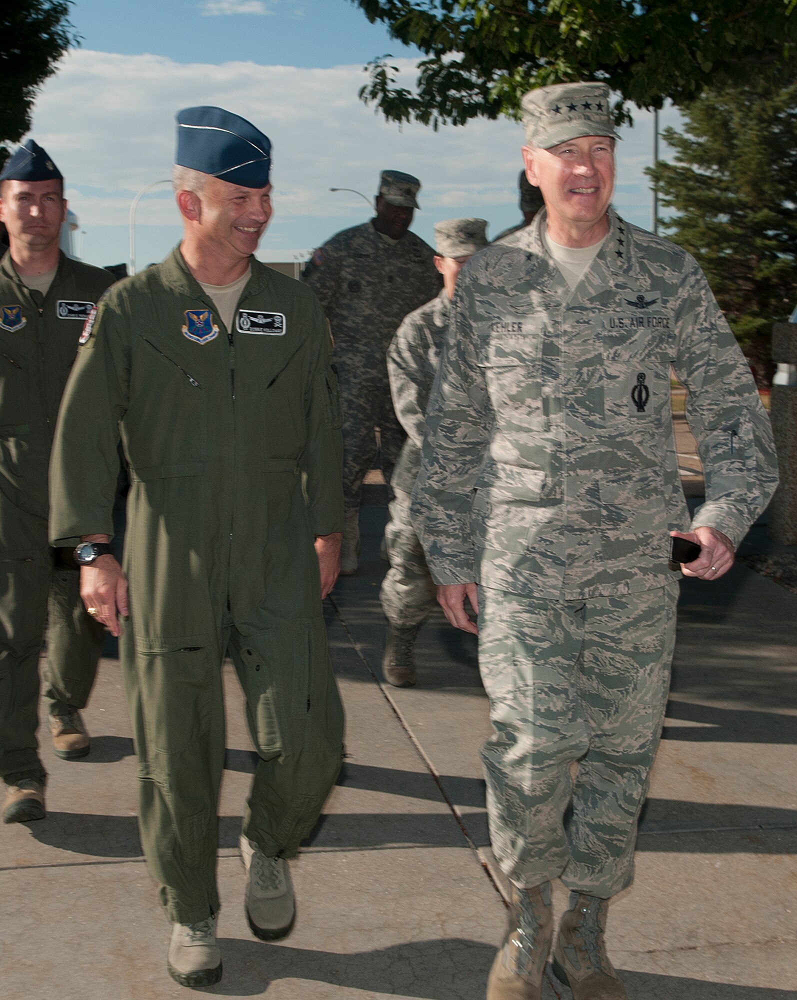 Gen. C. Robert Kehler, U.S. Strategic Command commander, is escorted by Col. Donnie Holloway, 90th Operations Group commander, during a visit to the group on F.E. Warren Air Force Base, Wyo., July 30, 2013. Kehler addressed missile crew members prior to their departure out to the field stressing the importance of their jobs and the confidence the national command structure has in their abilities. (U.S. Air Force photo by R.J. Oriez)