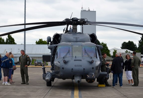 Aircrew members from the 943rd Rescue Group, Davis-Monthan Air Force Base, Ariz., talk about their HH-60G Pave Hawk helicopters and rescue mission with visitors at the 304th Rescue Squadron reunion picnic at Portland International Airport, Ore., July 28, 2013. (U.S. Air Force photo/Tech. Sgt. Anna-Marie Wyant)