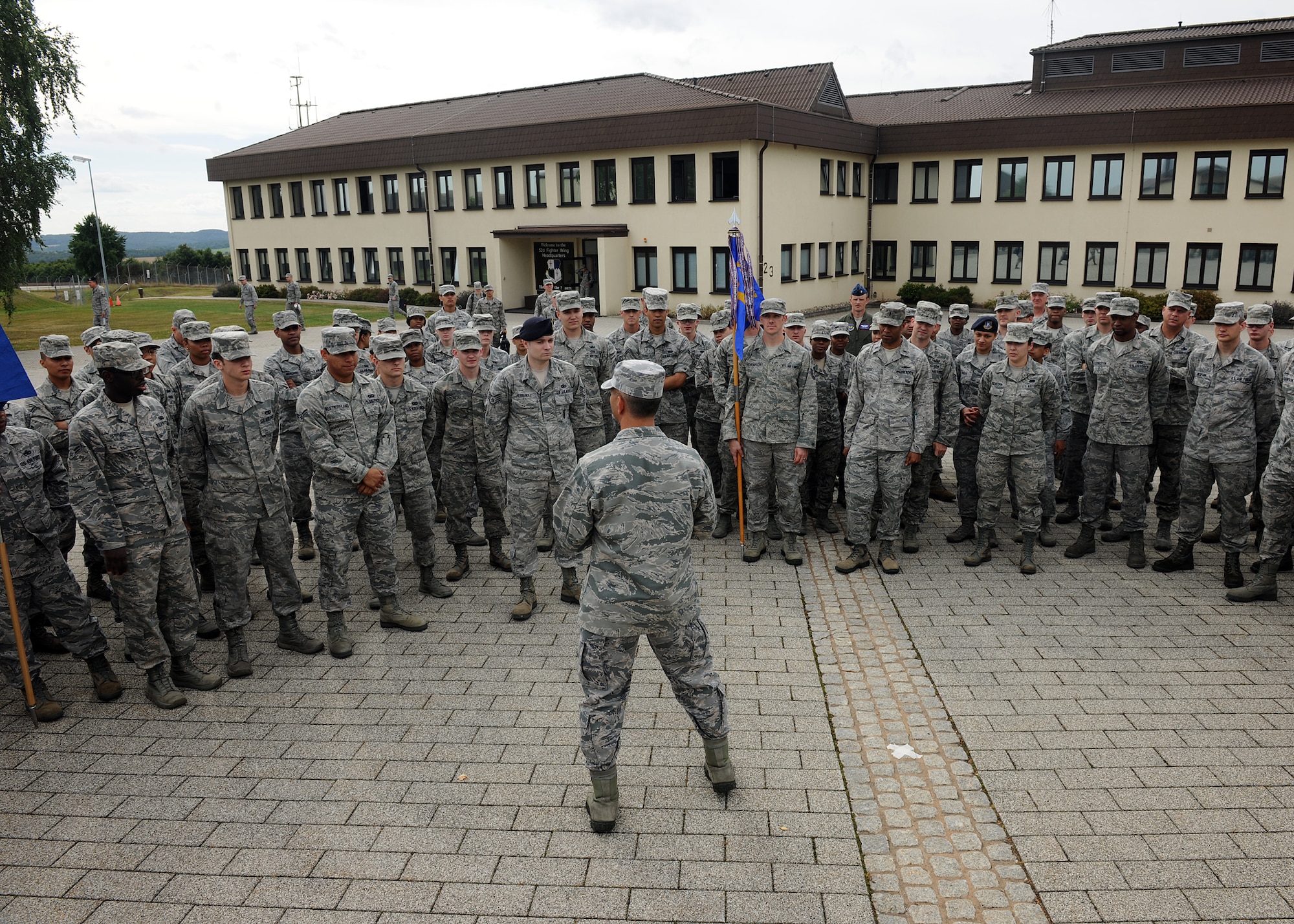 SPANGDAHLEM AIR BASE, Germany – U.S. Air Force Col. David Julazadeh, 52nd Fighter Wing commander, speaks with Spangdahlem Airmen about the importance of the military traditions after honoring Germany and the United States at a new wing retreat ceremony July 29, 2013. More than 100 Airmen participated in the ceremony, which will take place once a month during the summer. (U.S. Air Force photo by Staff Sgt. Daryl Knee/Released)