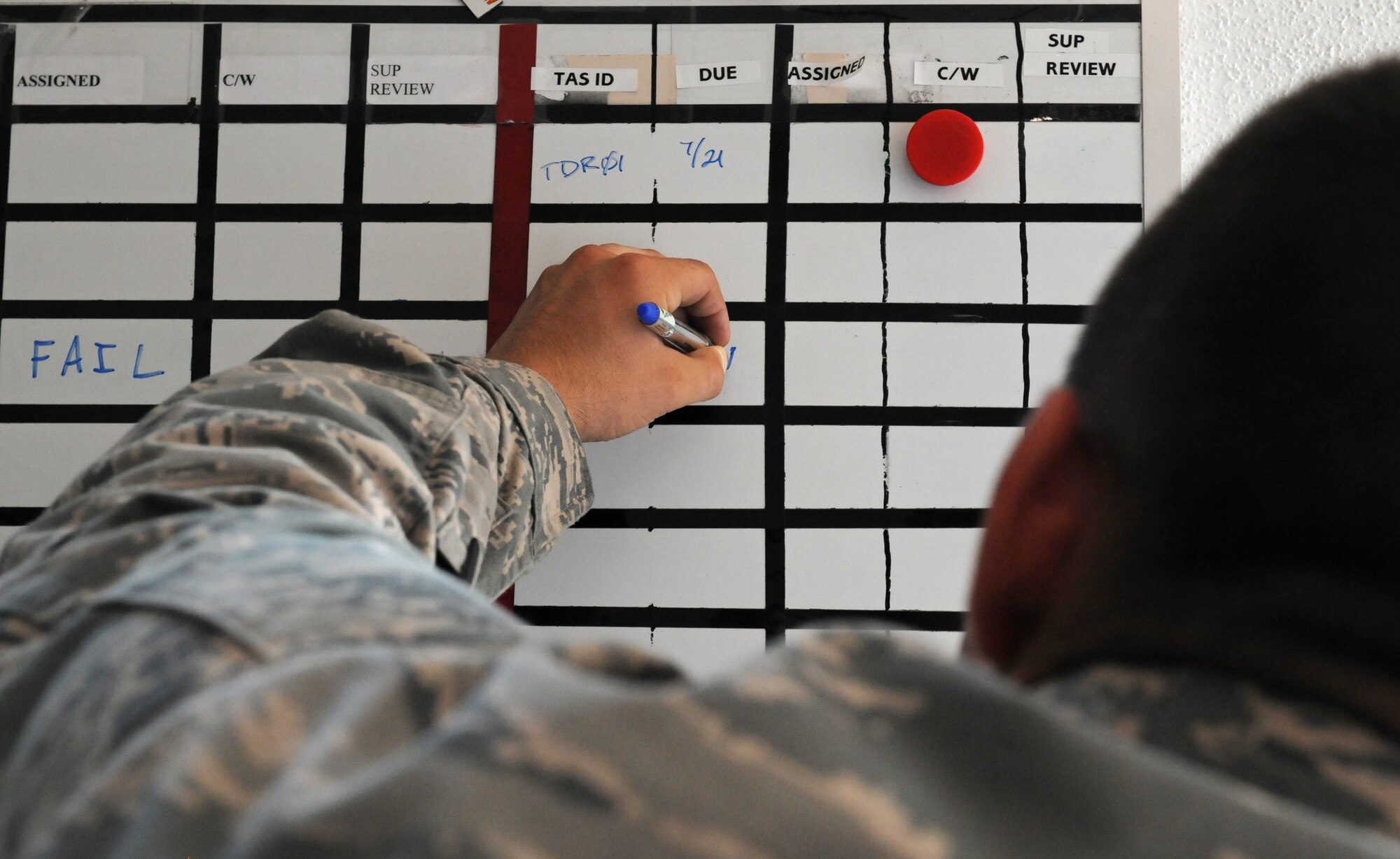 Airman 1st Class Eric Mangham, 86th Aircraft Maintenance Squadron C-130J Super Hercules engine specialist, updates the inspection board, July 23, 2013, Ramstein Air Base, Germany. Mangham is part of the 86th AMXS Sortie Support Flight who was recently named “Innovator of the Month” for their efforts to enhance quality of life in the work place, reduce spending and creating time-saving materials and shipping methods. (U.S. Air Force photo/Airman 1st Class Holly Mansfield)