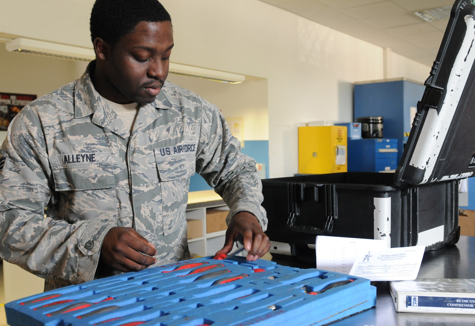 Senior Airman Markus Alleyne, 86th Aircraft Maintenance Squadron consolidated tool kit custodian, inspects equipment, July 23, 2013, Ramstein Air Base, Germany. Alleyne is part of the 86th AMXS Sortie Support Flight who was recently named “Innovator of the Month” for their efforts to enhance quality of life in the work place, reduce spending and creating time-saving materials and shipping methods. (U.S. Air Force photo/Airman 1st Class Holly Mansfield)