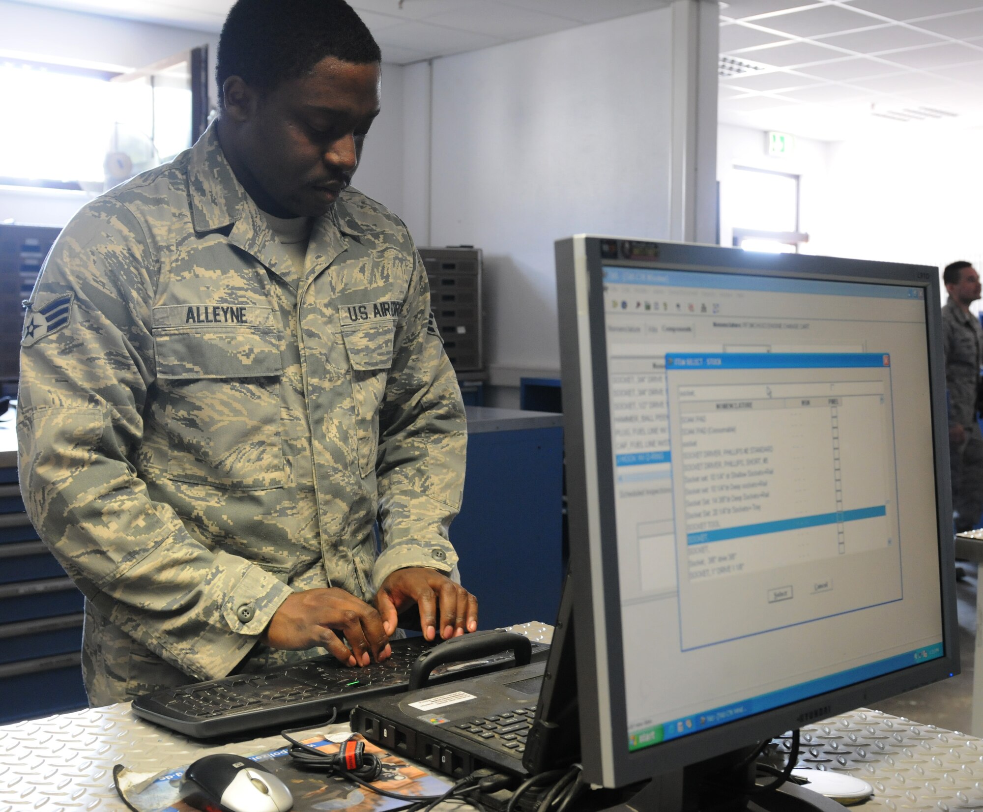 Senior Airman Markus Alleyne, 86th Aircraft Maintenance Squadron consolidated tool kit custodian, checks out equipment to aircraft maintainers, July 23, 2013, Ramstein Air Base, Germany. Alleyne is part of the 86th AMXS Sortie Support Flight who was recently named “Innovator of the Month” for their efforts to enhance quality of life in the work place, reduce spending and creating time-saving materials and shipping methods. (U.S. Air Force photo/Airman 1st Class Holly Mansfield)