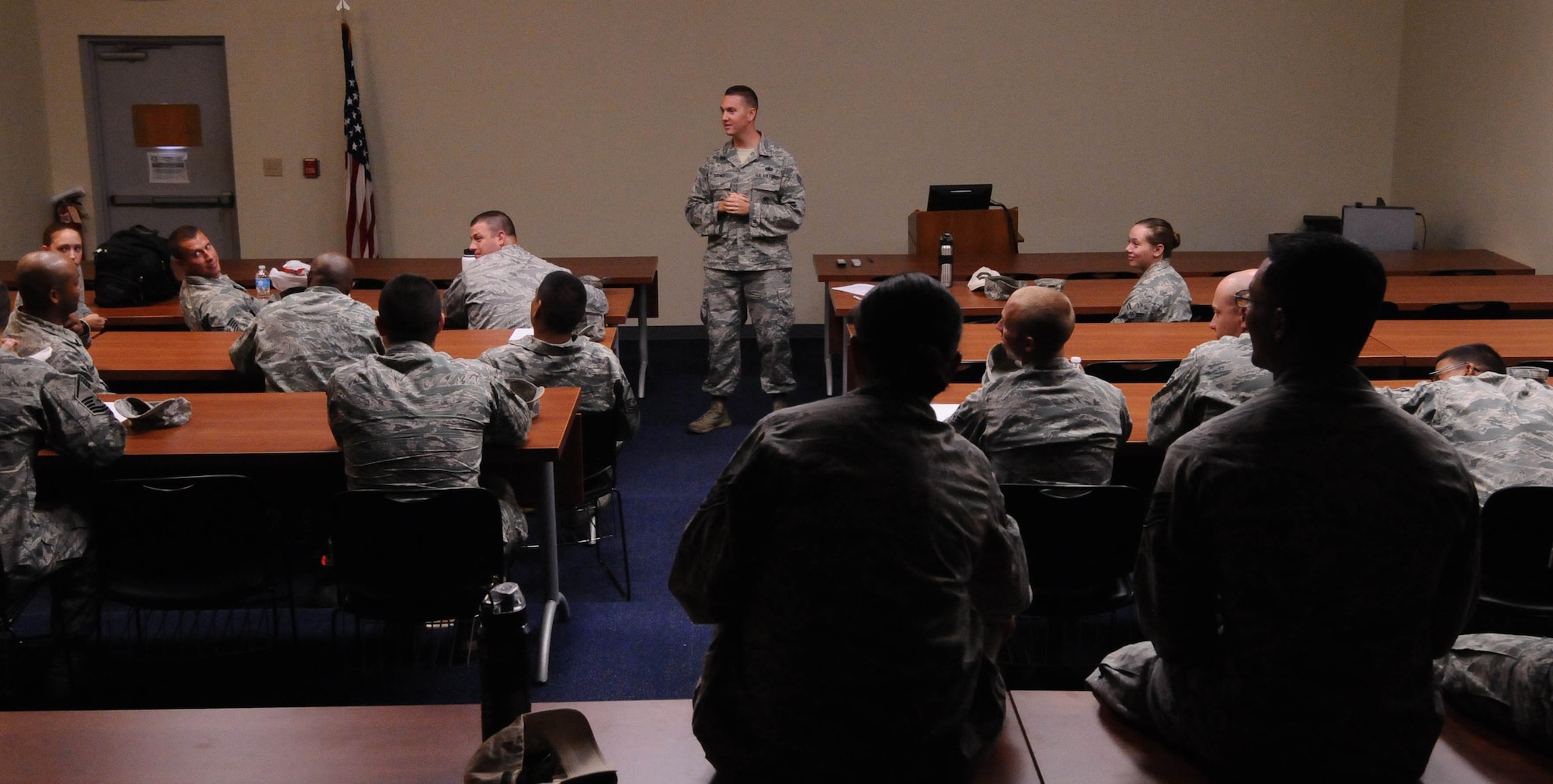 Staff Sgt. Ryan Dirner, 736th Security Forces Squadron ground combat instructor, briefs the 36th Civil Engineer Squadron prime Base Emergency Engineer Force about dismounted operations July 29, 2013, on Northwest Field, Guam. Prime BEEF Airmen spent time in a classroom learning a variety of ground combat skills including night vision, mission planning and development, different fighting positions and base security operations. (U.S. Air Force photo by Airmen 1st Class Emily A. Bradley/Released)