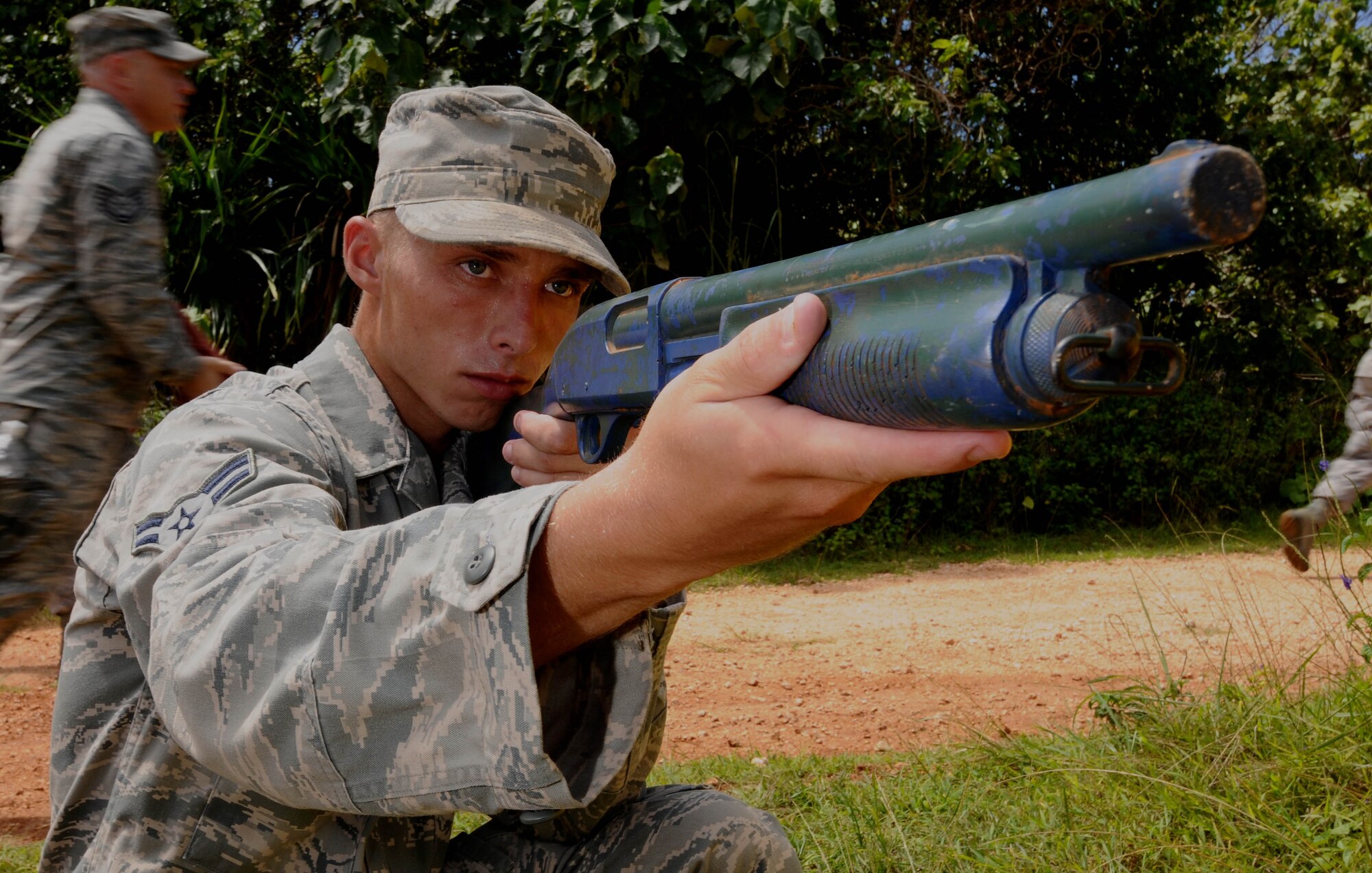 Airman 1st Class Brandon Elmenhurst, 36th Civil Engineer Squadron horizontal repair apprentice, performs a short halt during a patrol July 29, 2013, on Northwest Field, Guam. A short halt is when the formation takes up a defensive position before continuing the patrol. (U.S. Air Force photo by Airmen 1st Class Emily A. Bradley/Released)