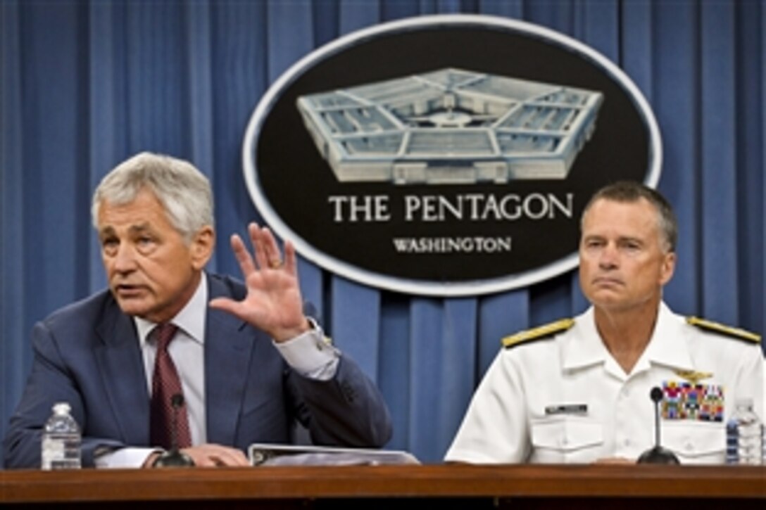 Defense Secretary Chuck Hagel answers questions from reporters on the Strategic Choices Management Review during a press briefing at the Pentagon, July 31, 2013. Navy Adm. James A. Winnefeld Jr., vice chairman of the Joint Chiefs of Staff, joined Hagel for the briefing. The review describes the impact of further budget reductions on the Defense Department and identifies options to deal with the additional cuts.