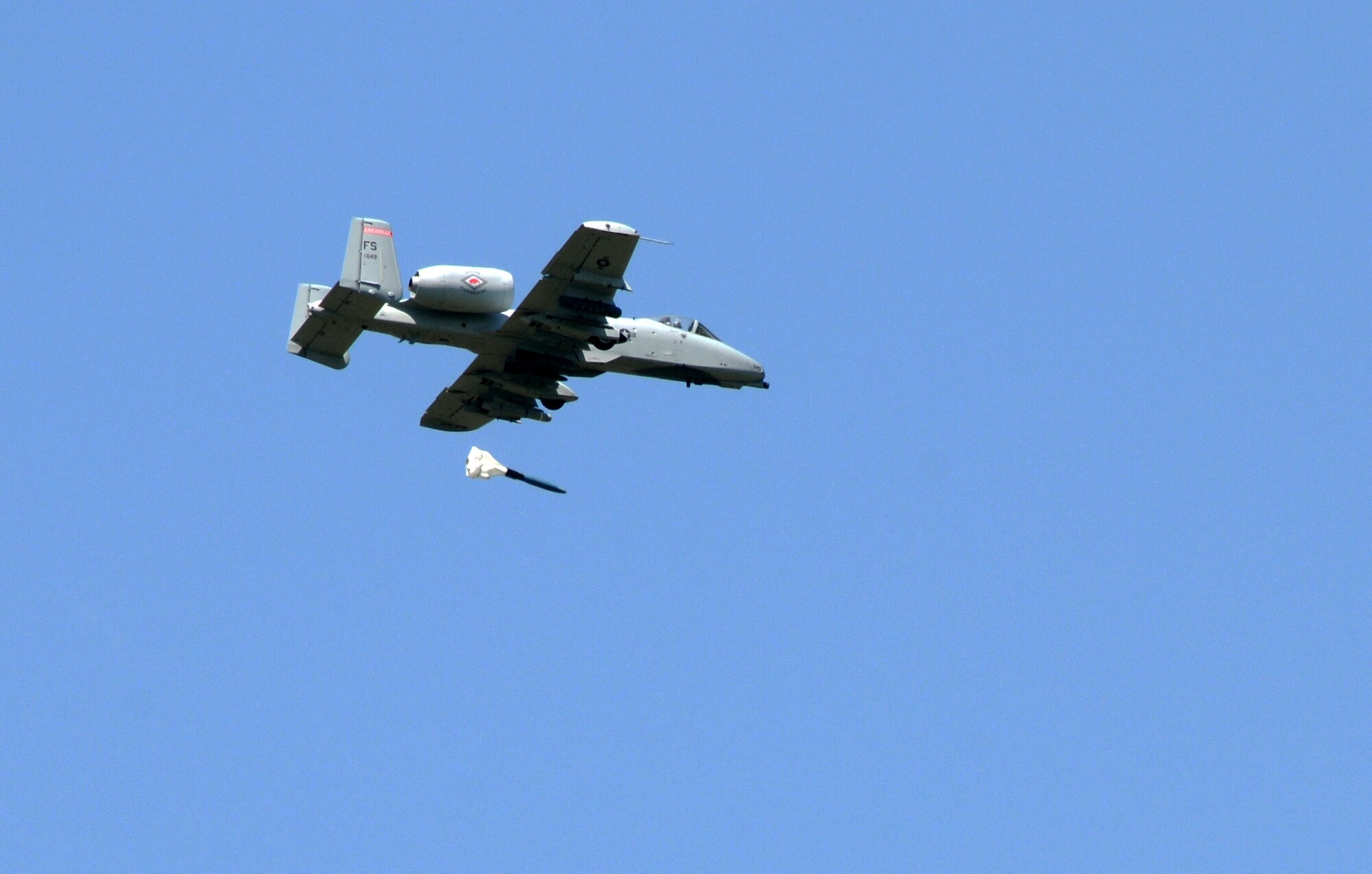 Capt. Joshua Parnell, a 188th Fighter Wing pilot, drops an inert GBU-12 laser-guided bomb May 11, 2013, during the wing's "turkey shoot," a competition among pilots consisting of precision bombing and strafing runs at Razorback Range, Fort Chaffee, Ark. The competition, which doubled as a training exercise for the pilots, is likely to be the wing's final one, as 188th will be transitioning from the A-10C Thunderbolt II to a remotely piloted aircraft mission in 2014. (U.S. Air National Guard photo by Senior Airman John Hillier/188th Fighter Wing Public Affairs)