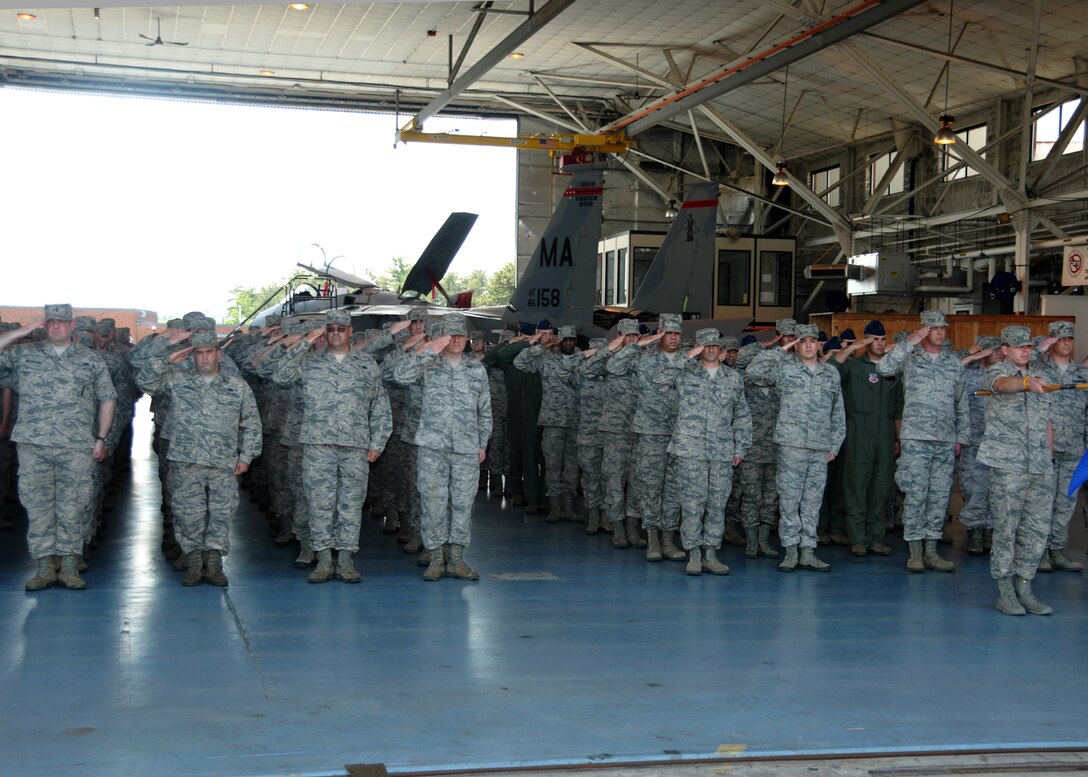 Members of the 104th Fighter Wing gather for a commander’s call on the flight line at Barnes Air National Guard Base, Westfield, Mass. June 1, 2013, to recognize members who have recently returned from deployments, present awards to Airmen for their distinguished service and observe two change of command ceremonies. (U.S Air National Guard photo by Master Sgt. Mark Fortin/ Released) 
