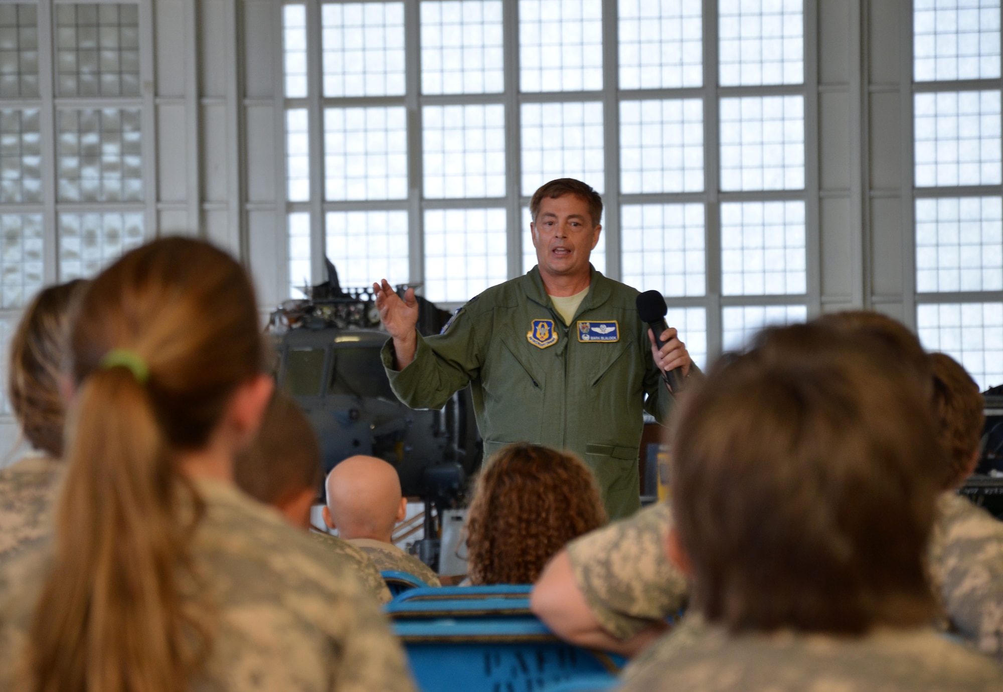 Col. Mark Blalock, 902th Operations Group commander, talks to Air Force-dependent children about their parents and deployments during the Kids Understanding Deployment Operations event at Patrick Air Force Base June 1, 2013. (U.S. Air Force photo/Tech. Sgt. Anna-Marie Wyant)