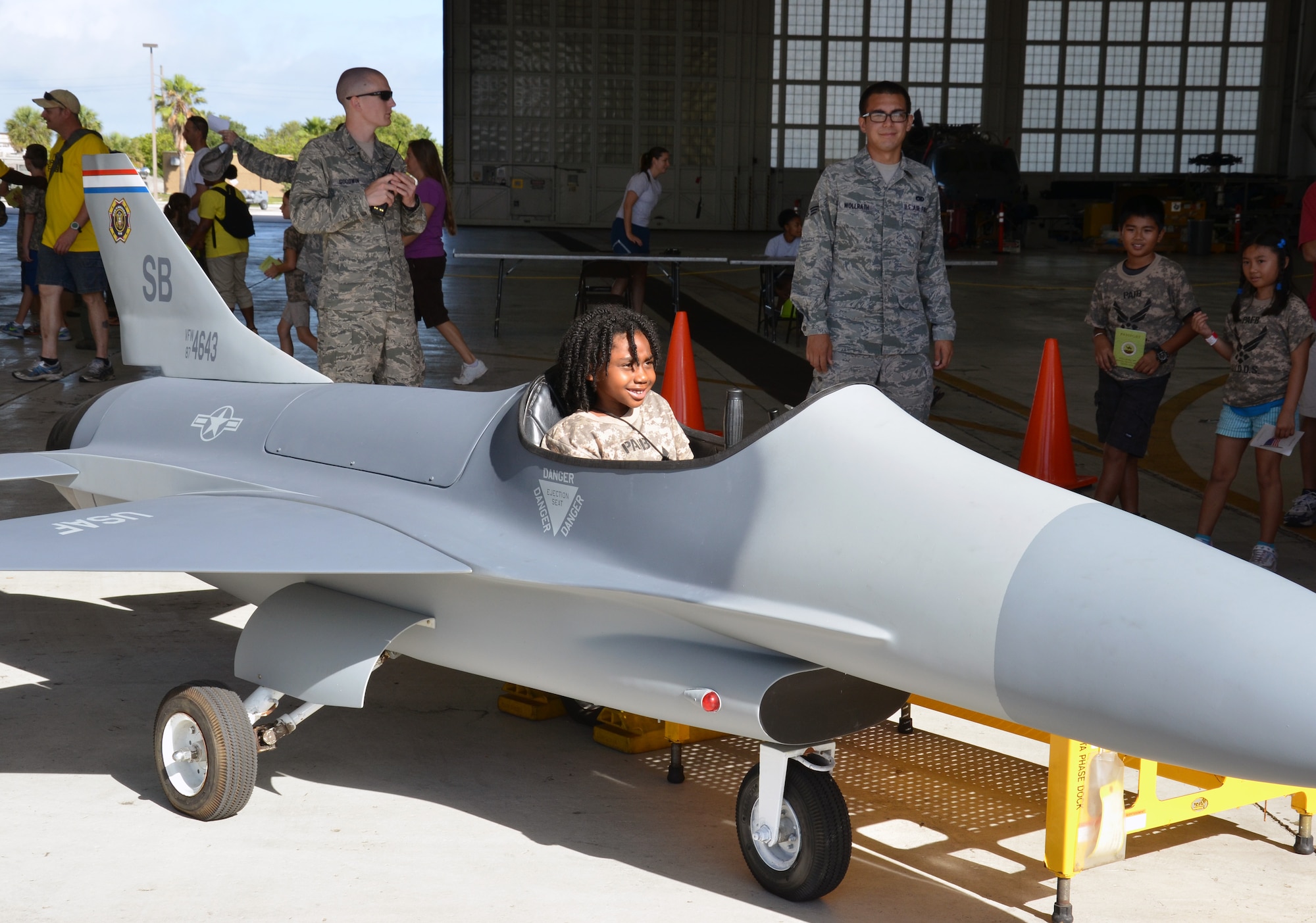 An Air Force-dependent child sits in a model fighter jet during the Kids Understanding Deployment Operations event at Patrick Air Force Base June 1, 2013. (U.S. Air Force photo/Tech. Sgt. Anna-Marie Wyant)