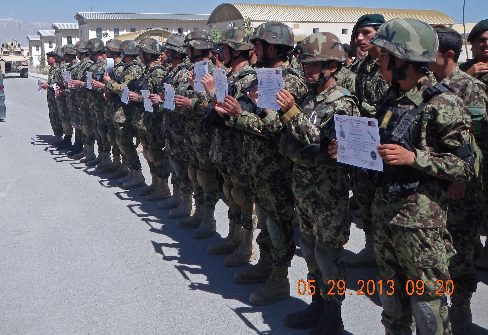 The newest members of the Kabul Air Wing Quick Reaction Company proudly showoff completion certificates at a ceremony May 29, 2013 at Kabul International Airport, Afghanistan. Fourteen AAF members of the KAW QRF Company graduated from a 50-hour Ground Combat Skills Course. The graduation marked the completion of advanced upgrade training for the members of the QRF Company. The team trained on numerous types of procedures including mounted and dismounted operations, military operations in urban terrain, close quarters battle, building clearing, entry control point operations, combat lifesaver and advanced M-16 utilization. (U.S. Air Force photo/Staff Sgt. Chris McAleer)