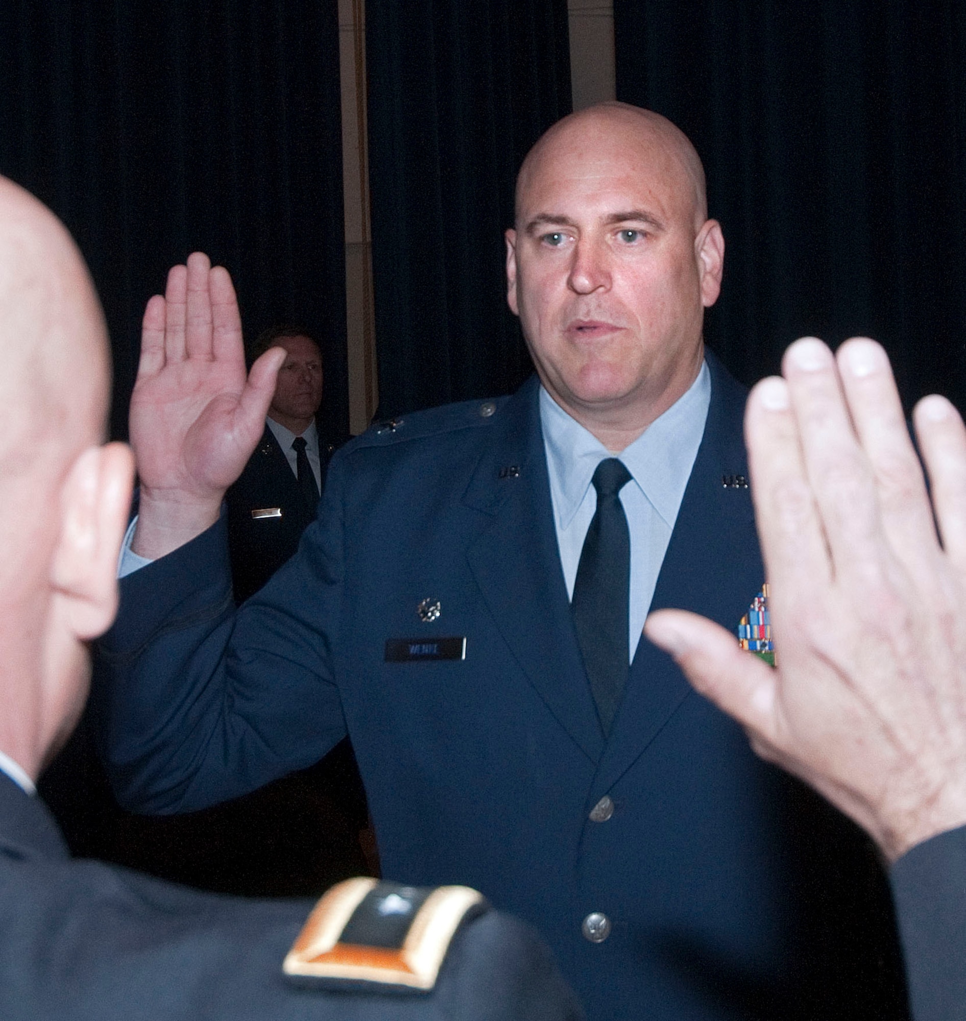 JOINT BASE ELMENDORF-RICHARDSON, Alaska -- Brig. Gen. Donald S. Wenke, commander of the Alaska Air National Guard's 176th Wing, receives his oath of office from Maj. Gen. Thomas Katkus, Alaska's adjutant general, at a ceremony here June 2, 2013. National Guard photo by Capt. John Callahan.