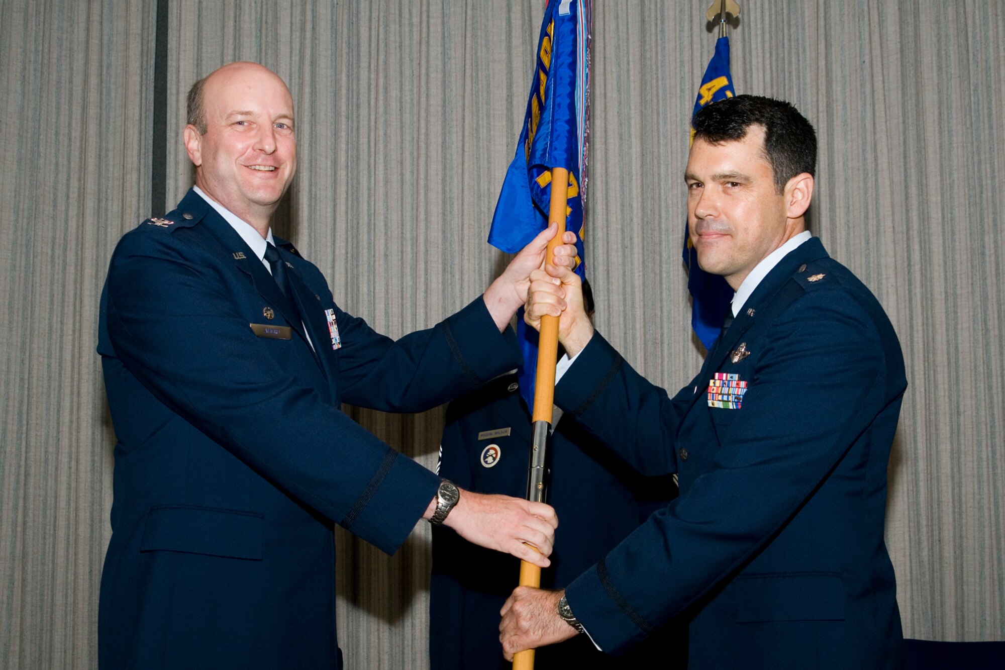 GRISSOM AIR RESERVE BASE, Ind. - Lt. Col. Erik Aufderheide, 72nd Air Refueling Squadron commander, receives the unit guidon from Col. Christopher Amend, 434th Operations Group commander during a change of command ceremony here June 1. Aufderheide replaced Lt. Col. Douglas Gullion as the new 72nd ARS commander. (U.S Air Force photo/Staff Sgt. Andrew McLaughlin)
