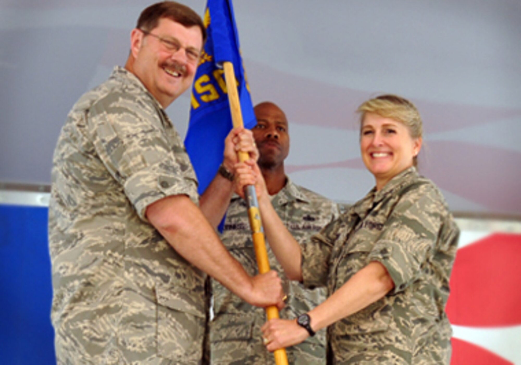 Col. Karen Magnus receives command of the 916th Mission Support Group from Col. Gregory Gilmour, 916th Air Refueling Wing commander.  Outgoing MSG commander Col. James B. Hurley assumes command of the Mission Support Group at Charleston AFB, S.C.  The change of command ceremony was held June 1, 2012.  (USAF photo by SSgt. Mark Thompson, 916ARW/PA)