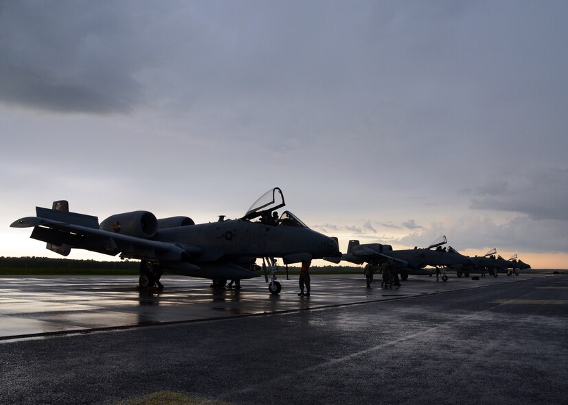 Mechanics with the 175th Aircraft Maintenance Squadron, Maryland Air National Guard perform a post flight inspection in the rain for four A-10C Thunderbolt II after their arrival at Amari Air Base, Estonia on May 31, 2013 for Saber Strike. Saber Strike is a multinational exercise involving approximately 2,000 personnel from 14 countries which is designed to strengthen trust and interoperability among participants. (U.S. Air National Guard photo by Staff Sgt. Benjamin Hughes)