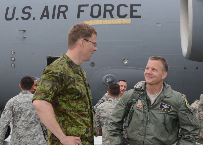 Col. Jaak Tarien, Commander of the Estonian Air Force speaks with  U.S. Air Force Brig. Gen. Scott L. Kelly (Right), Commander, 175th Wing, Maryland Air National Guard on the flight line in front of a C-17 Globemaster III at Amari Air Base, Estonia on May 31, 2013 for Saber Strike.  Saber Strike is a multinational exercise involving approximately 2,000 personnel from 14 countries which is designed to strengthen trust and interoperability among participants. (U.S. Air National Guard photo by Staff Sgt. Benjamin Hughes)