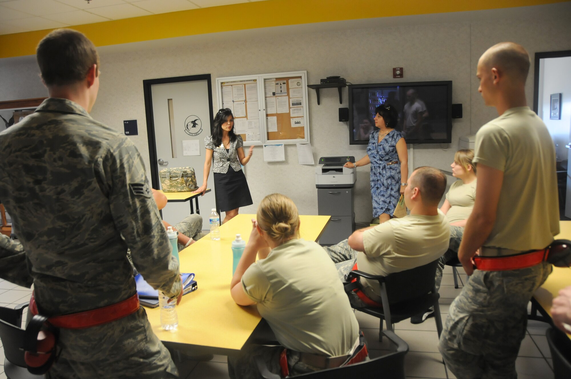Ms. Bethy Vallejo (center), personal financial counselor for the Joint Services Assistance Program for Virginia, gives a briefing at the 192nd Fighter Wing Maintenance Squadron on financial planning, debt management and credit building, as part of the Military Saves Program June 1, 2013. The Military Saves Program is a national campaign that works to encourage military families to save money and to convince leaders and organizations to be aggressive in promoting automatic savings. (U.S. Air National Guard photo by Airman 1st Class Johnisa B. Roberts/Released)