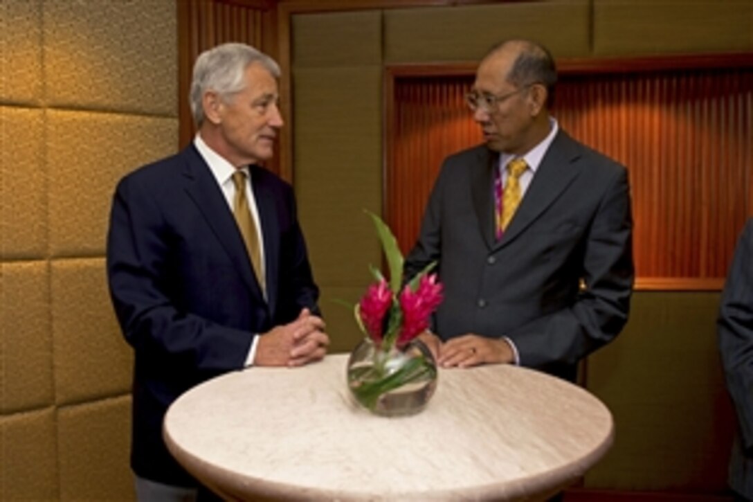 U.S. Defense Secretary Chuck Hagel talks with Bruneian Deputy Defense Minister Dato Mustappa at the Shangri-La Dialogue in Singapore, June 2, 2013. Hagel participated in bilateral and trilateral talks with several defense ministers and toured the USS Freedom docked in Singapore. From there, Hagel travels to Brussels for meetings with NATO defense ministers.

