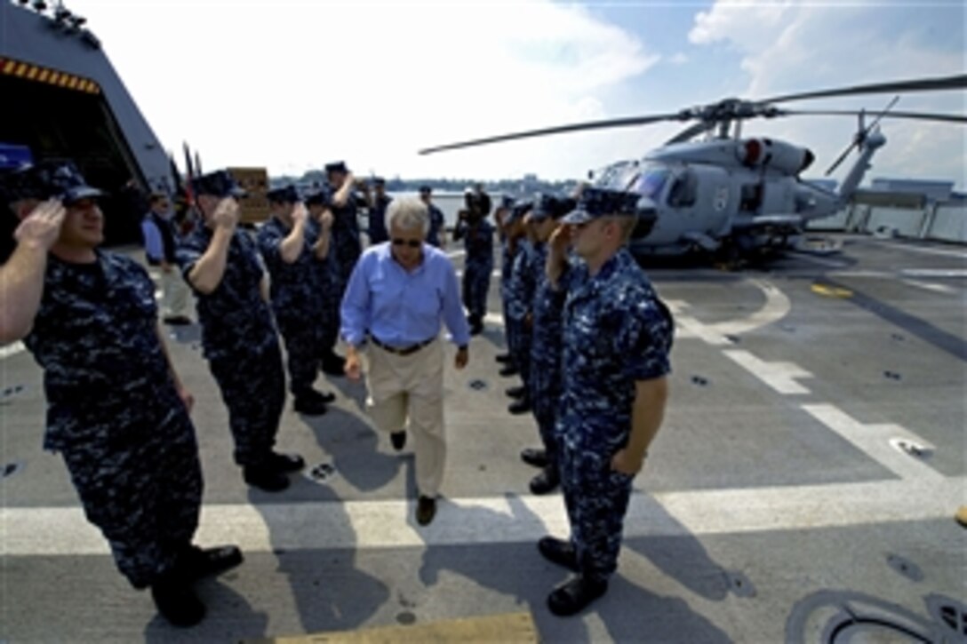 U.S. Defense Secretary Chuck Hagel addresses the crew of the USS Freedom in Singapore, June 2, 2013. Hagel toured the ship, visited with sailors, and watched a demonstration of a reconfigurable and waterborne mission. Hagel also attended the Shangri-La Dialogue in Singapore and will head to Brussels for more meetings with NATO defense ministers.