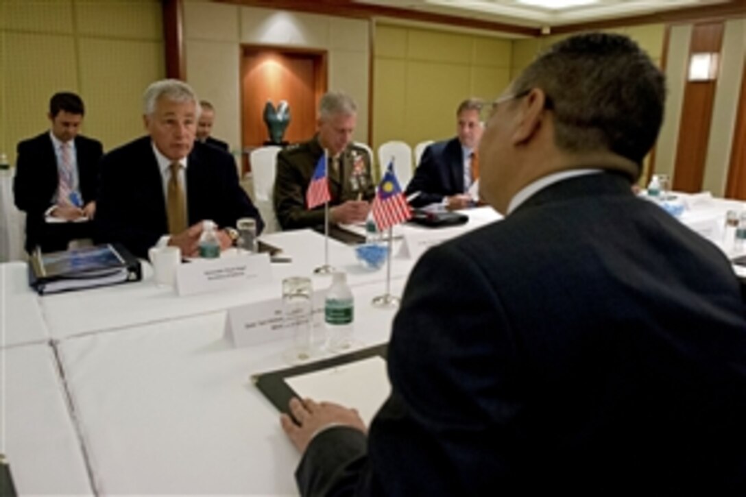 U.S. Defense Secretary Chuck Hagel meets with Malaysian Defense Minister Hishammuddin Hussein at the Shangri-La Dialogue in Singapore, June 2, 2013. 
