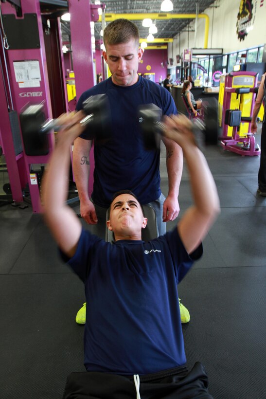 Sgt. Kevin Marra, back, a Marine Recruiter working in Springfield, Ma., works out with Ryan Alicea, an 18-year-old and Springfield, Ma., native at a local Planet Fitness Gym, May 24, 2013. Marra regularly creates fitness-goal-specific diet plans as well as leads intense workouts, to help prepare people for the physical rigors of Marine Corps Boot Camp. (Official Marine Corps Photo by Sgt. Richard Blumenstein) 