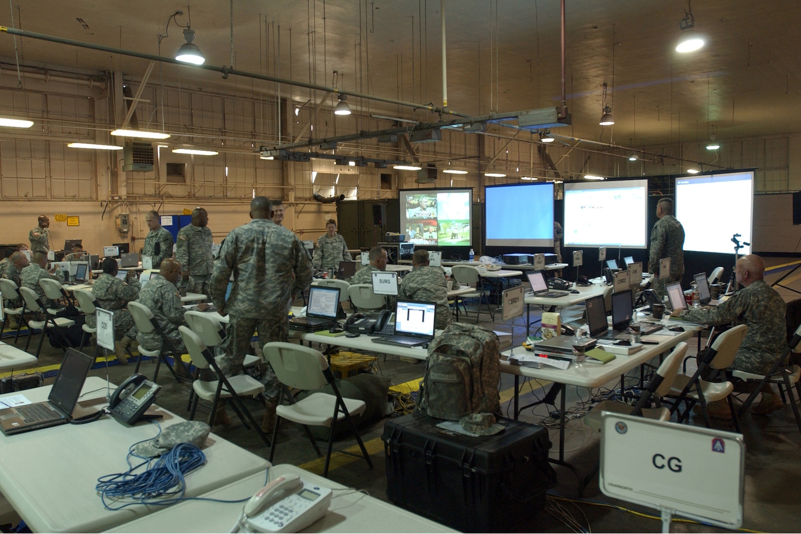 Members of 5th Army Operational Command Post Two monitor and coordinate relief efforts on March Air Force Base in Riverside, Calif., Oct. 25, 2007, as part of a federal support package used to assist agencies responding to the California wildfires. DoD photo by Senior Airman Daniel St. Pierre, U.S. Air Force. (Released)