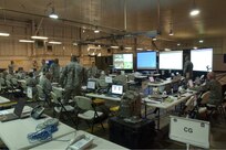 Members of 5th Army Operational Command Post Two monitor and coordinate relief efforts on March Air Force Base in Riverside, Calif., Oct. 25, 2007, as part of a federal support package used to assist agencies responding to the California wildfires. DoD photo by Senior Airman Daniel St. Pierre, U.S. Air Force. (Released)