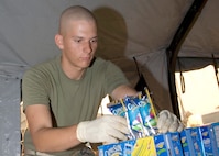 Lance Cpl. Cory Schultz from the 24th Foxtrot Company stationed at Camp Pendleton volunteers his time to help out stranded families at the evacuation center on Turner Field located on the Naval Amphibious Base Coronado. More than 400 military families from San Diego County and the surrounding areas take refuge from the wildfires struck several San Diego communities.  More than a quarter-million people were urged to flee their homes across Southern California as wildfires blown by fierce desert winds raced over the landscape with terrifying speed, destroying hundreds of structures, clogging highways, sending smoke and ash over a wide area. The numerous fires in San Diego County currently threaten no Navy facilities. The Navy is working with various agencies to aide in combating the fires and providing assistance to both military and civilians. 

U.S. Navy photo by Mass Communication 2nd Class Mark A. Leonesio
